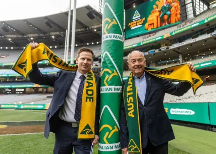 Ben Lazzaro & John Cann celebrate beneath the MCG footy goals.